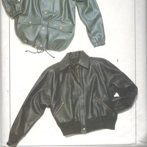 May include: A sewing pattern for two different styles of jackets. The pattern is for a bomber jacket and a shirt jacket. Both jackets are made of faux leather and have a dark green color. The pattern is from Donna Salyers' Fabulous Fakes, The Luxurious Alternative. The pattern number is 022.