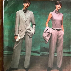 May include: A sewing pattern for a suit with a blazer and trousers. The pattern is for sizes 18, 20, and 22. The pattern is by DKNY, Vogue American Designer.