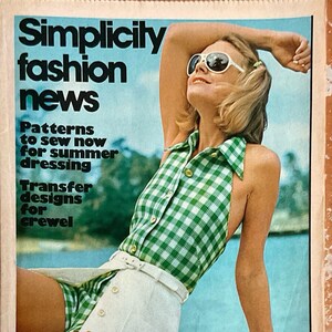 May include: A vintage Simplicity fashion magazine cover featuring a woman wearing a green and white gingham halter top and a white skirt. The magazine cover text reads "Simplicity fashion news" and "Patterns to sew now for summer dressing" and "Transfer designs for crewel".
