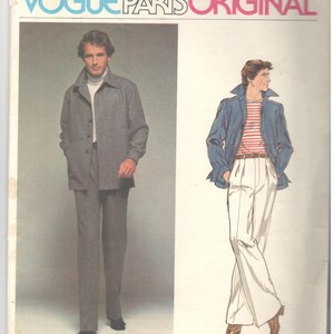 May include: A vintage sewing pattern for a men's suit. The pattern is for a jacket and pants. The jacket is a dark gray color and has a button-up front. The pants are a light gray color and have a straight leg. The pattern is from Vogue Paris Original and is designed by Christian Dior. The pattern number is 1609.