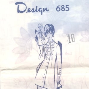 May include: A vintage sewing pattern for a dress with a collar and long sleeves. The pattern is called "Design 685" and is a "New Multi-Stamp Transfer Pattern".
