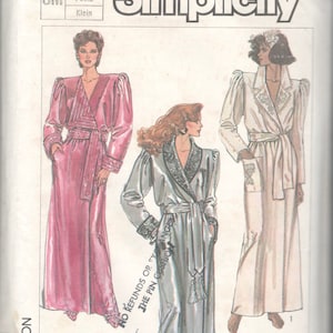May include: Simplicity sewing pattern number 7186 for a long robe with a shawl collar, sash tie, and long sleeves. The pattern includes three different styles of robes, one in pink, one in silver, and one in white.