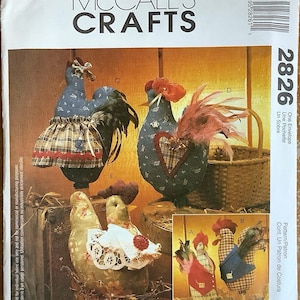 May include: McCall's Crafts pattern for creating fabric rooster and hen decorations. The image displays several completed rooster and hen designs with diverse fabric patterns, including plaid and floral prints. The pattern number is 2826.