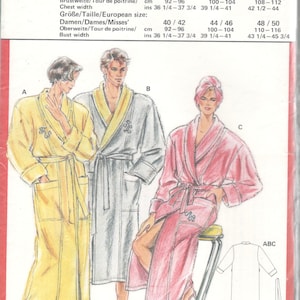 May include: A sewing pattern for three robes, one yellow, one gray, and one pink. The pattern includes instructions for sizes 46-48, 50-52, and 54-56. The pattern also includes instructions for sizes 40-42, 44-46, and 48-50.
