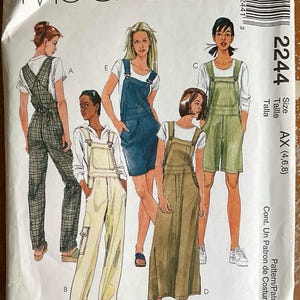 May include: McCall's sewing pattern envelope featuring illustrations of overalls and jumpers. The envelope displays various styles, including long pants, shorts, and a dress, in different colors and patterns. The size range is AX (4,6,8).