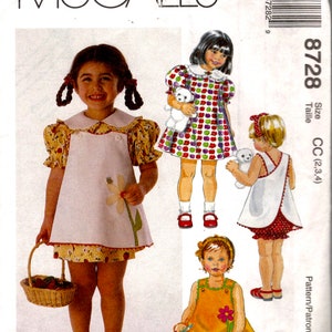 May include: A sewing pattern for making children's dresses. The pattern includes three different styles of dresses, all with a simple, classic design. The dresses are shown on three different girls, each with a different hairstyle and accessories. The pattern is for sizes CC (2, 3, 4).