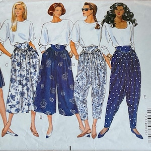 May include: Butterick 5277 sewing pattern showing women's trousers and skirt designs. The designs include culottes, wide-leg trousers, and a skirt, all paired with white tops. The pattern is labelled "Fast & Easy."