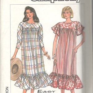 May include: Simplicity sewing pattern 8012, featuring illustrations of two dresses. One dress is plaid with a ruffled hem, the other is striped with floral accents. The text "E-A-S-Y TO SEW" is visible.