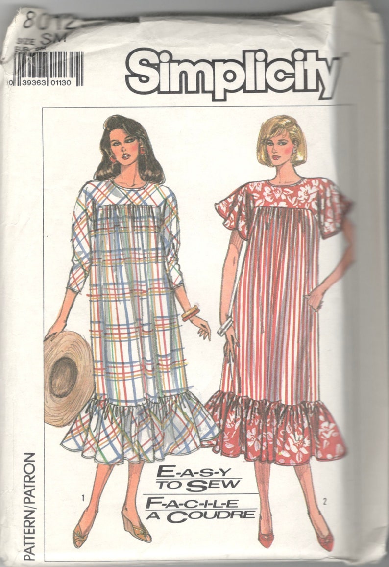 May include: Simplicity sewing pattern 8012, featuring illustrations of two dresses. One dress is plaid with a ruffled hem, the other is striped with floral accents. The text "E-A-S-Y TO SEW" is visible.