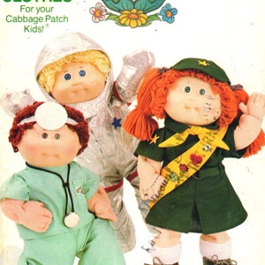 May include: A vintage sewing pattern for Cabbage Patch Kids clothes. The pattern includes three different outfits: an astronaut suit, a doctor's uniform, and a Girl Scout uniform. The pattern is from Butterick and has the number 3728.
