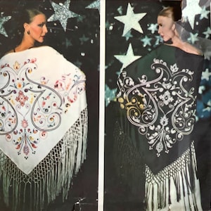 May include: A vintage Vogue Patterns sewing pattern for a shawl with a white and black embroidered design. The pattern number is 1334.