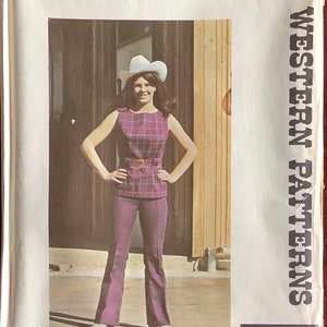 May include: Vintage sewing pattern for a Western-style outfit. The pattern features a sleeveless top and flared pants in a plaid pattern. The image shows a woman wearing the outfit, complete with a cowboy hat. The pattern is from Authentic Patterns, Inc.