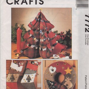 May include: A sewing pattern for a Christmas tree, wreath, and stockings. The pattern includes instructions for making a tree centerpiece, a wreath, and stockings. The pattern is from McCall's Crafts and is called "Home for the Holidays".