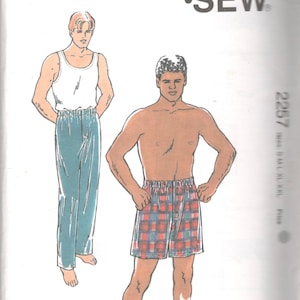 May include: A sewing pattern for men's pajama pants. The pattern includes two different styles: one with a solid blue color and the other with a plaid pattern. The pattern is from Kwik Sew Pattern Co., Inc. and is for sizes S-M-L-XL-XXL.