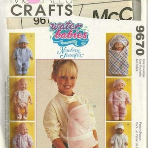 May include: A sewing pattern for making baby clothes and accessories. The pattern includes instructions for making a baby carrier, a baby envelope, and a baby outfit. The pattern is from McCall's Crafts and is for Water Babies Newborn Jennifer.