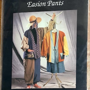 May include: A fashion design image featuring a patchwork coat and pants ensemble. The coat is displayed on a mannequin and worn by a person, showcasing a mix of colors and patterns. The text "Kanustandit Coat and Easion Pants" is visible.