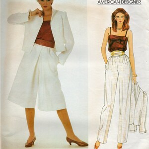May include: Vogue Patterns American Designer sewing pattern for a white culotte and a white and brown striped pant. The pattern is designed by Edith Head and the pattern number is 2923.