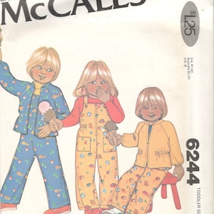 May include: A sewing pattern for toddler-sized clothing. The pattern includes three outfits: a blue jacket and pants with a white and blue pattern, a red shirt and yellow overalls with a white and yellow pattern, and a yellow jacket and pants with a white and yellow pattern. The pattern is from McCall's and is number 6244.
