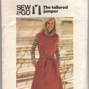 May include: A vintage sewing pattern for a tailored jumper. The pattern is from Butterick and is size 10. The pattern is called "Sew & Go" and features a woman wearing a red jumper with a striped shirt underneath.