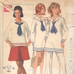 Könnte beinhalten: Ein Vintage-Schnittmuster für ein Kleid und eine Hose. Das Schnittmuster ist von Butterick und trägt die Nummer 5234. Das Schnittmuster ist für die Größen 7 bis 14. Das Kleid hat einen Matrosenkragen und eine Krawatte. Die Hose ist weit geschnitten.
