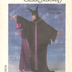 May include: A sewing pattern for a Maleficent costume from the Walt Disney Company. The pattern is for size small and includes instructions for making a black and purple robe with a pointed hood.