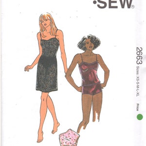 May include: A sewing pattern for a slip dress and a camisole top. The pattern is from Kwik Sew and is for sizes XS-S-M-L-XL. The pattern number is 2663.