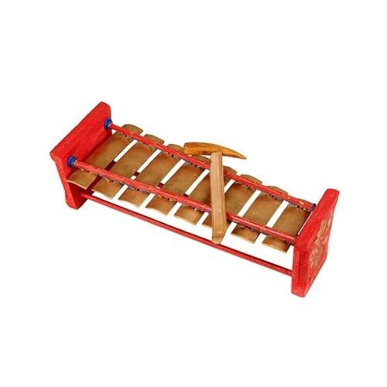 May include: A red wooden xylophone with brass bars and two wooden mallets. The xylophone is a musical instrument used in many cultures.