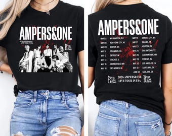 May include: Black t-shirt with the band name "AMPERS&ONE" in white, a group photo, and tour dates. The back of the shirt lists tour cities and dates. "Borat Define" is printed at the bottom.