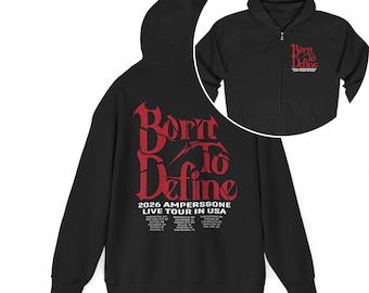 May include: Black zip-up hoodie with a red graphic that reads "Born to Define" and "2026 AMPERS&GONE LIVE TOUR IN USA". The hoodie has a hood and a front pocket. A smaller image of the hoodie is in the upper right corner.
