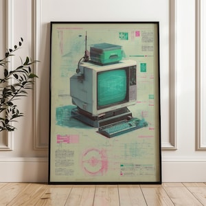 May include: Framed print featuring a vintage computer with a green screen, keyboard, and a small green box on top. The background includes technical diagrams in shades of blue, pink, and green. The print is in a black frame.