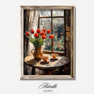 May include: A painting depicting a still life with a vase of red tulips, two teacups and saucers on a wooden table, and a window overlooking a garden.