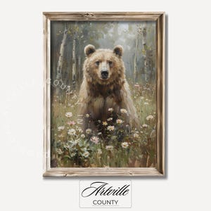 May include: A framed painting depicting a brown bear standing in a field of white wildflowers. The bear is looking directly at the viewer. The background is a blurred forest scene.