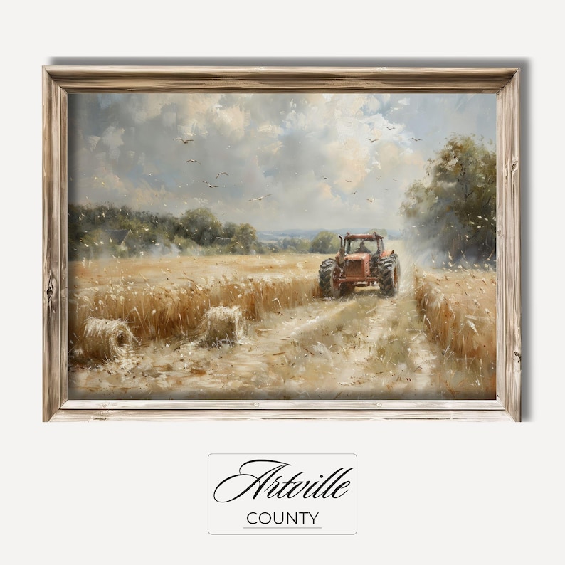 Puede incluir: Pintura enmarcada de un paisaje rural con un tractor rojo en un camino de tierra a trav&eacute;s de un campo de trigo. La obra de arte tiene un marco de madera r&uacute;stico, un cielo nublado y balas de heno. El texto "Artville County" est&aacute; en la parte inferior.