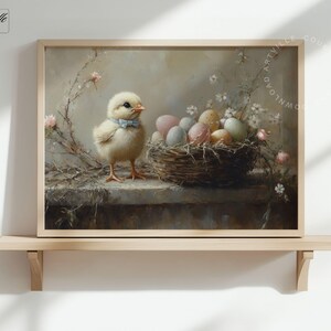 May include: A framed print featuring a charming yellow chick wearing a blue bow tie, standing next to a nest filled with pastel-colored eggs. The artwork has a vintage aesthetic with soft lighting and floral accents, perfect for Easter decor.