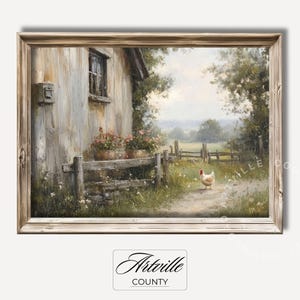 May include: A framed painting depicting a white chicken walking on a path in front of a rustic wooden fence and a white farmhouse with a window. The scene is set in a rural countryside with green grass and trees.