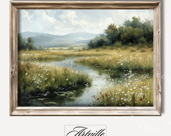 May include: A painting of a landscape with a winding river flowing through a field of wildflowers. The river is surrounded by lush green grass and trees. The sky is blue with white clouds. The painting is framed in a light brown wooden frame.