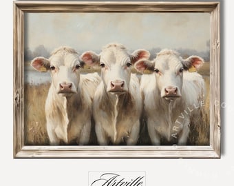 May include: A painting of three white cows standing in a field. The cows are looking directly at the viewer. The painting is framed in a light wood frame.