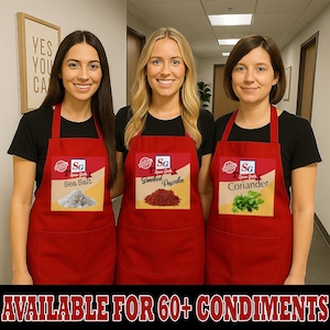May include: Three people wearing red aprons with spice labels. The aprons feature the text "Sea Salt", "Smoked Paprika", and "Coriander". The aprons have a pocket and the text "AVAILABLE FOR 60+ CONDIMENTS" is at the bottom.