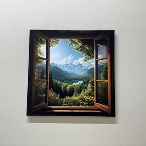 May include: A framed canvas print of a window looking out onto a mountain range and a lake. The window is open and the view is framed by green trees.