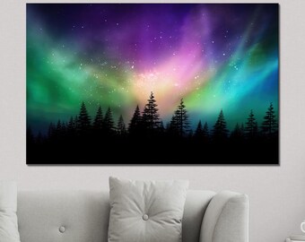May include: A vibrant aurora borealis, a colorful display of green, purple, and pink light, illuminates the night sky above a silhouette of a dark forest.