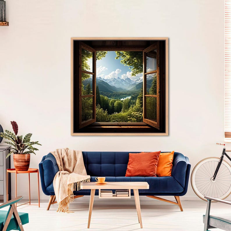 May include: A framed print of a window view with a mountain range and a lake in the distance. The window is open and the view is framed by green trees.