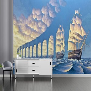 Puede incluir: Una impresi&oacute;n de arte digital que presenta un paisaje surrealista con dos barcos de vela. Los barcos navegan en un cuerpo de agua frente a un arco de piedra que parece flotar en el cielo. El cielo es de un azul claro con nubes blancas.