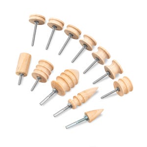 May include: A set of 12 wooden sanding drums in various shapes and sizes. The drums are made from natural wood and have a smooth finish. They are attached to metal shafts and are designed for use with a rotary tool.