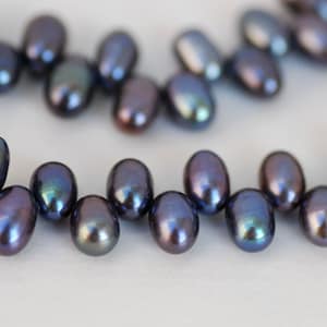 Batche SALE 3  Full strands  Top Drilled AAA Gem quality 5.5mm X 8mm dancing Freshwater Pearl 85 pc peacock blue rice pearls
