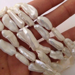 AAA Biwa Pearl Beads: White Ivory Freshwater Stick Strand (16", 24-26mm)