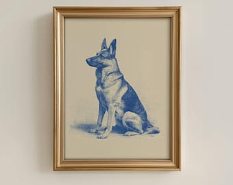 Puede incluir: Una impresión enmarcada con una ilustración azul y blanca de un perro pastor alemán sentado. El perro está representado en un estilo vintage detallado. El marco es de color dorado, lo que añade un toque clásico a la obra de arte.