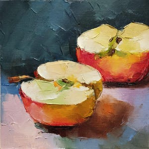 May include: Oil painting of two halves of a red and yellow apple. The cut fruit reveals a pale green core and creamy white flesh. The background is a dark teal color, with visible brushstrokes.