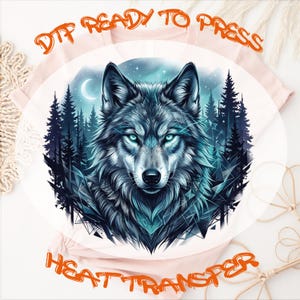 May include: A light pink t-shirt featuring a circular graphic of a wolf head with glowing blue eyes, set against a dark forest and night sky with a crescent moon. The text DTF READY TO PRESS HEAT TRANSFER is printed in orange above and below the graphic.