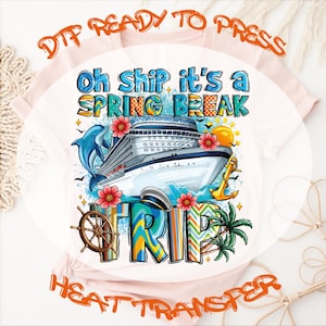 May include: A light pink t-shirt featuring a graphic design with a cruise ship, a blue dolphin, a yellow anchor, a ship wheel, palm trees, and red flowers. The text reads "Oh ship it's a SPRING BREAK TRIP" in blue and orange lettering.