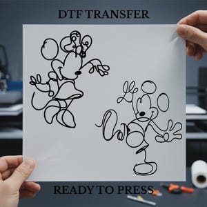May include: A white sheet with black line art of Minnie Mouse and Mickey Mouse. The sheet has the text "DTF TRANSFER" at the top and "READY TO PRESS" at the bottom. The images are held by hands.